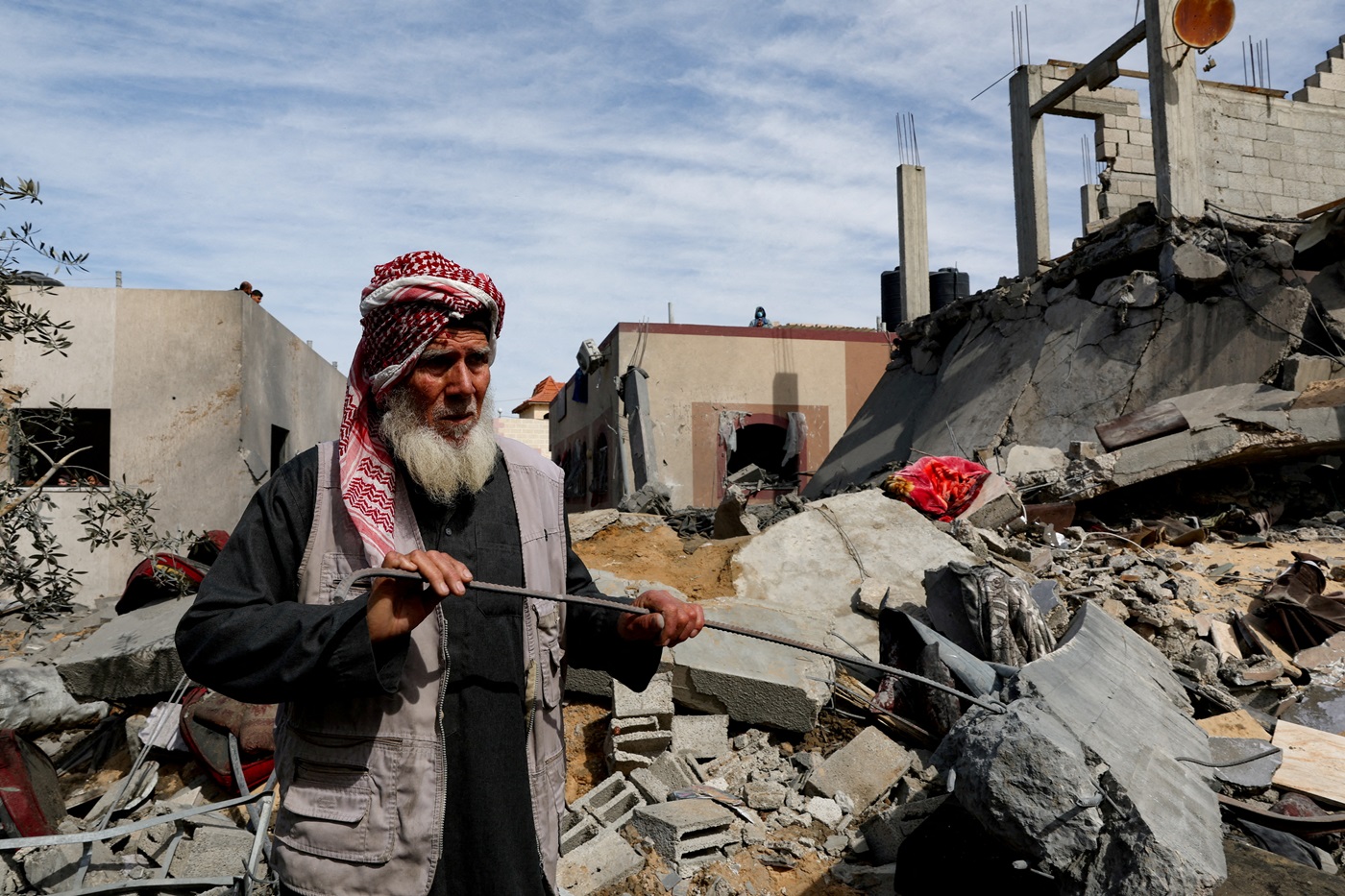 A Palestinian stands at the site of an Israeli strike on a house in Rafah in the southern Gaza...