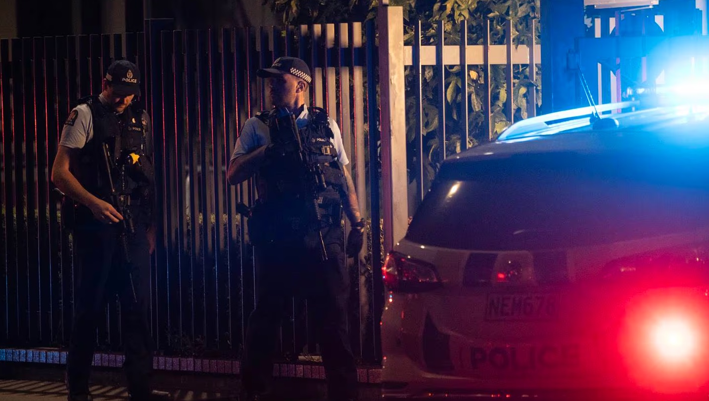 Armed police on Hereford St following the fatal stabbing. Photo: George Heard