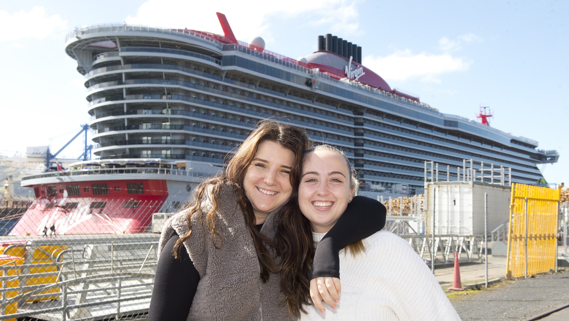 Passengers Abbey Lobsinger (left) and Jess Barker, of Brisbane, pose in front of Resilient Lady...