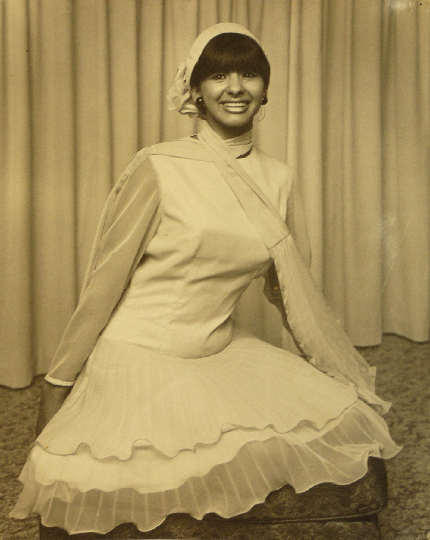 An unknown woman models garments from the Eden Hore Central Otago collection. The Eden Hore...