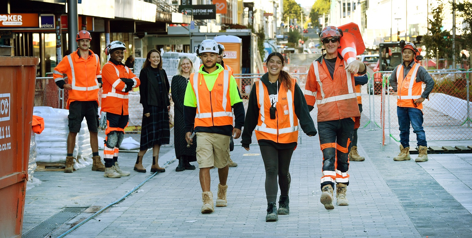 Construction workers (front from left) Talia Walsh, Hayley Poni and Marty McDonnell strut down...