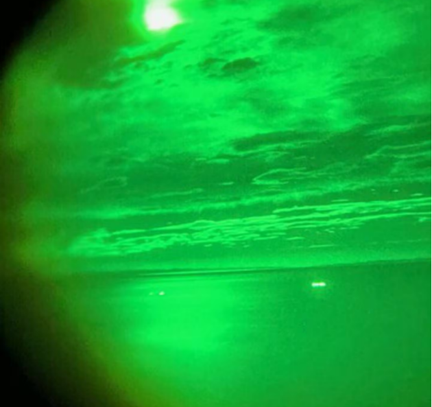 A picture taken during the rescue mission with the night-vision goggles used by the Lowe...