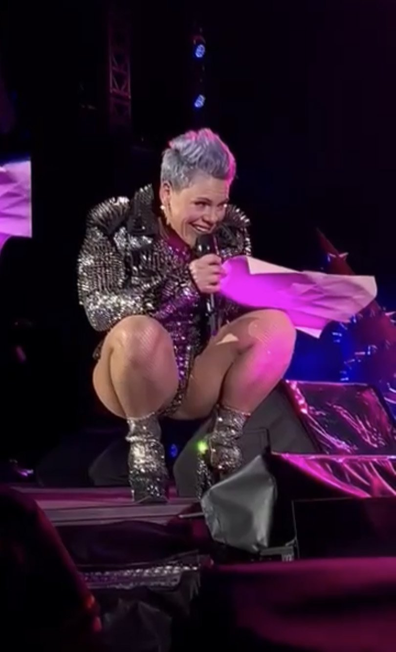 Singer-songwriter Pink signs Ms White and Ms Cresswell’s tattoo poster during her concert at...