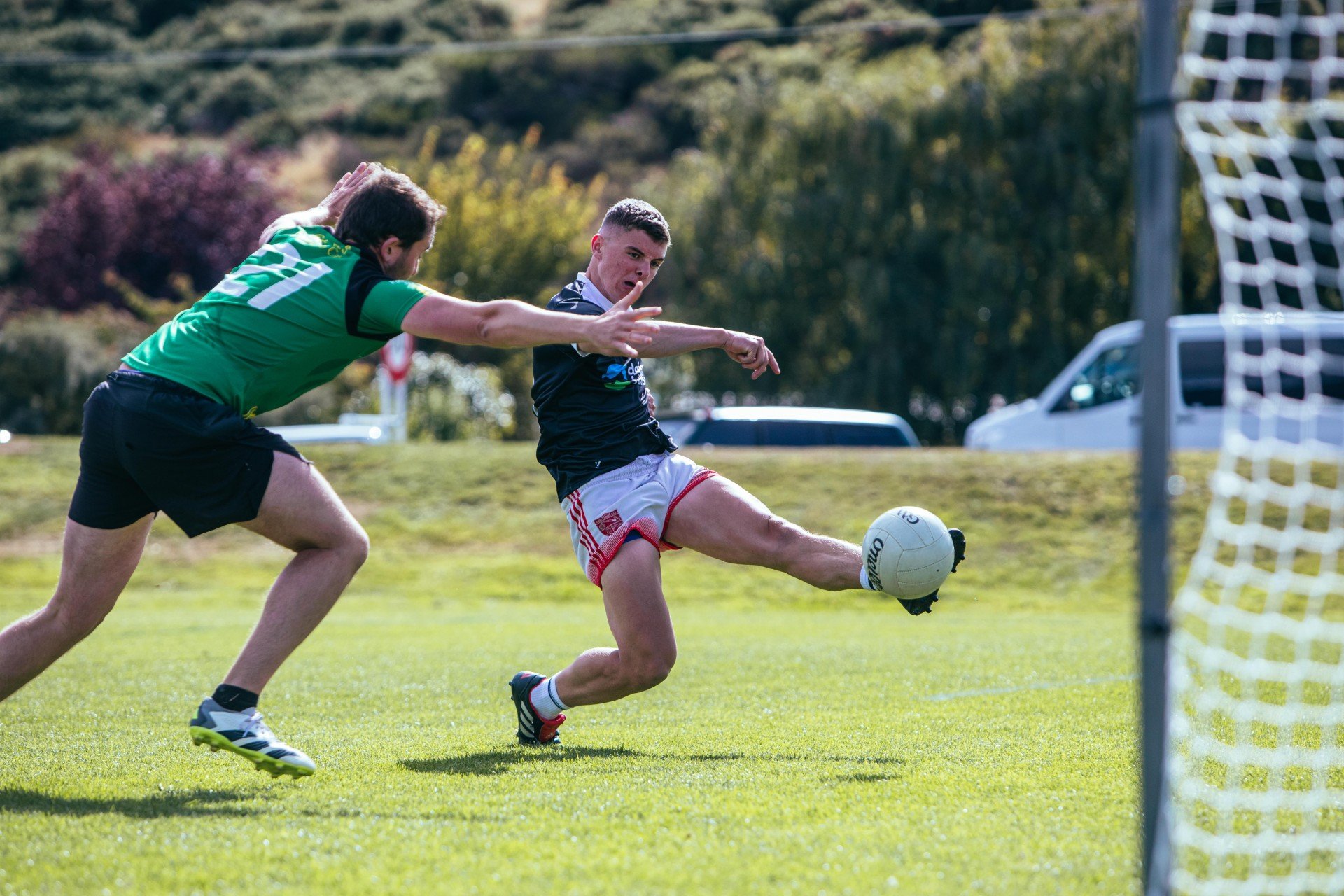 St Pat’s Emerald City Gaelic football player, Ger Sheehan, tries to shut down Adrian O’Dea, of...