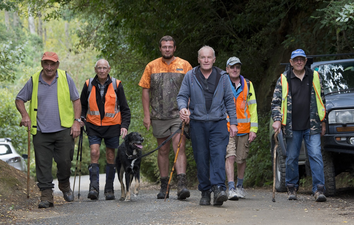 Search volunteers (from left) Murray Cumming, Gus Brownlie, Robert Bloem, Mac the dog, Trevor...