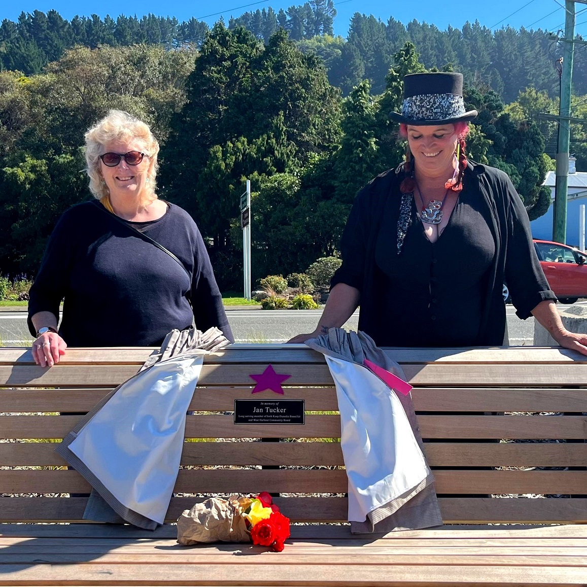 Unveiling a plaque and seat to honour Jan Tucker are West Harbour Community Board chairwoman Ange...