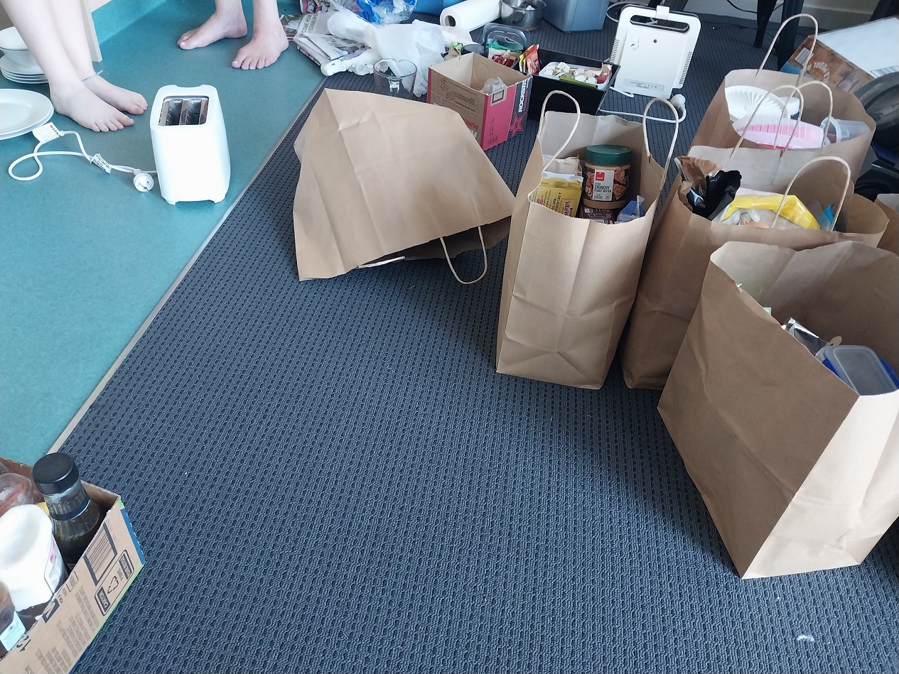 Cathy and her daughter packing up from their motel room to be shifted to different transitional...