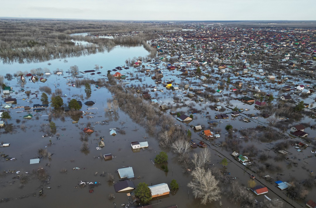 A drone view shows a flooded residential area in the settlement of Zarechnoye in Russia's...