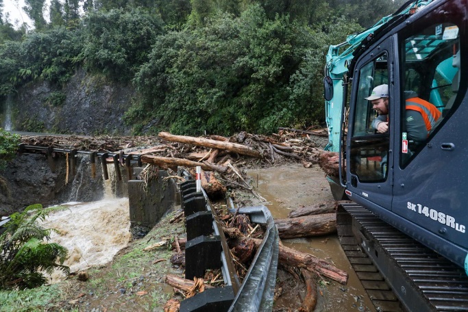 Crews working to clear a slip on State highway 6 near Franz Josef yesterday. Photo: Supplied via...