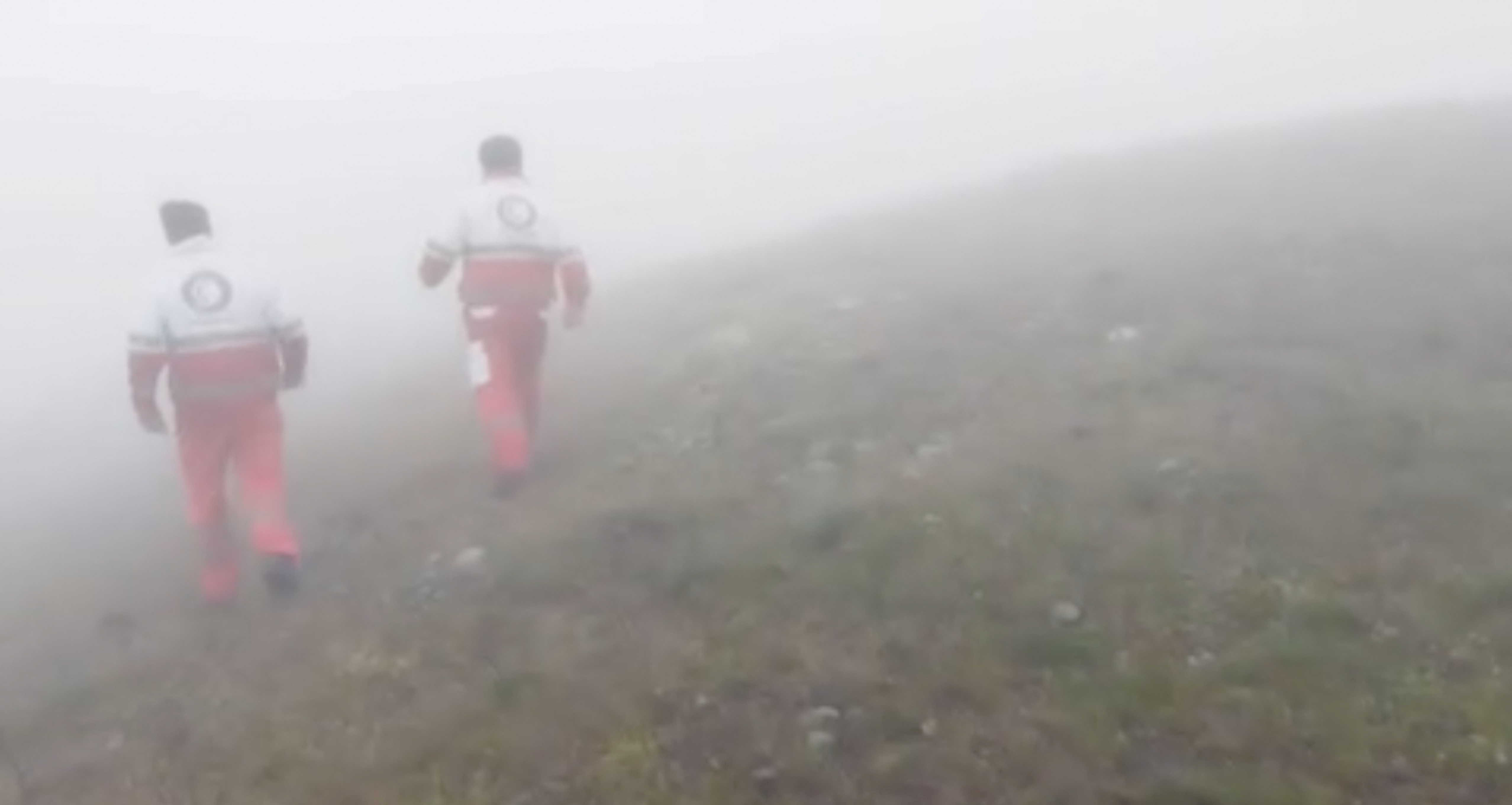 Emergency personnel set off to search for the helicopter in foggy conditions in  in Varzaqan ,...