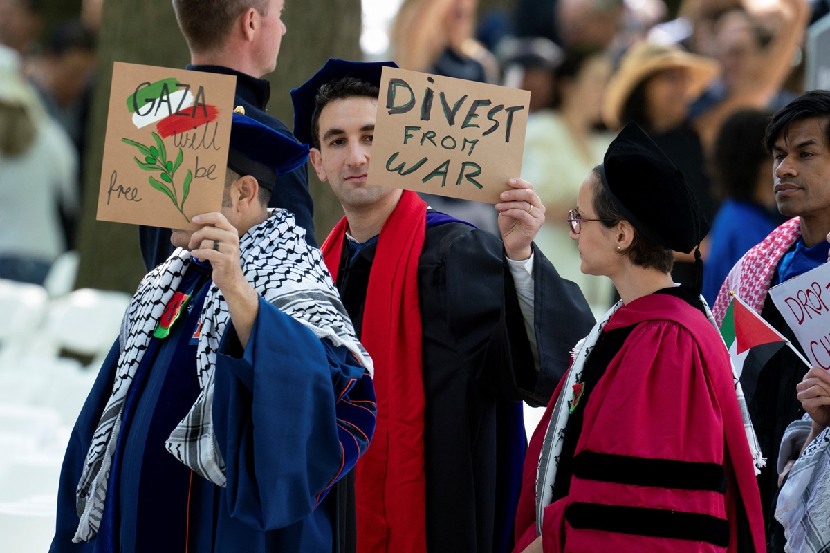 Graduates protest against the conflict between Israel and Hamas during the commencement at Yale...