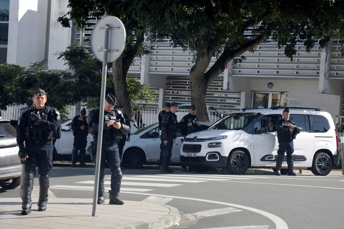 Security forces guard the French High Commissioner's office as French President Emmanuel Macron...