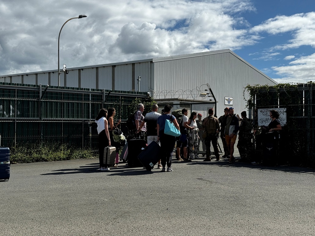 Evacuees arrive to board flights at the airport in Noumea at the weekend. Photo: Reuters