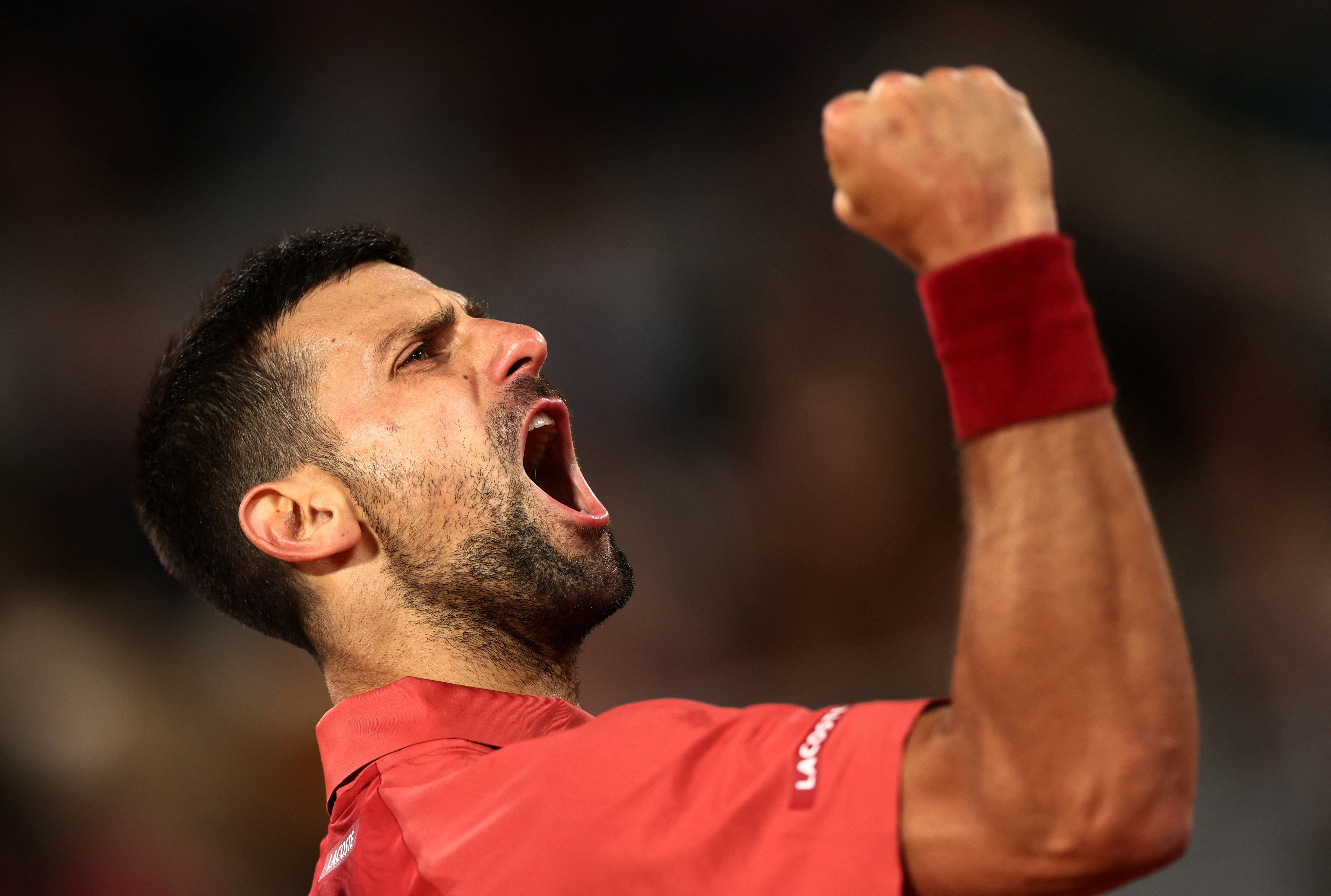 Defending champion Novak Djokovic celebrates getting through to round two of the French Open....