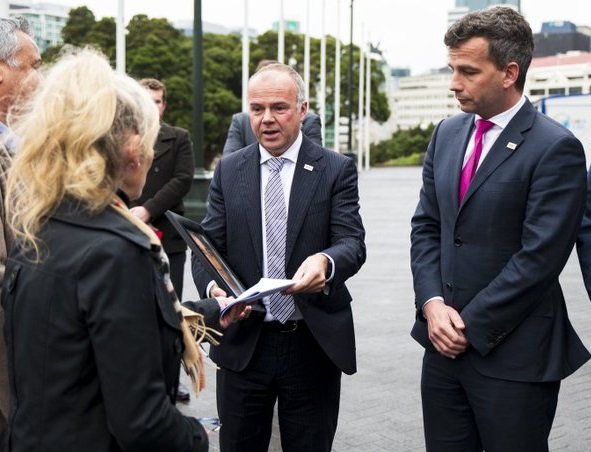 Meila Davis’ grandmother Sandy Gibbons presents a petition to Act New Zealand’s Todd Stephenson ...