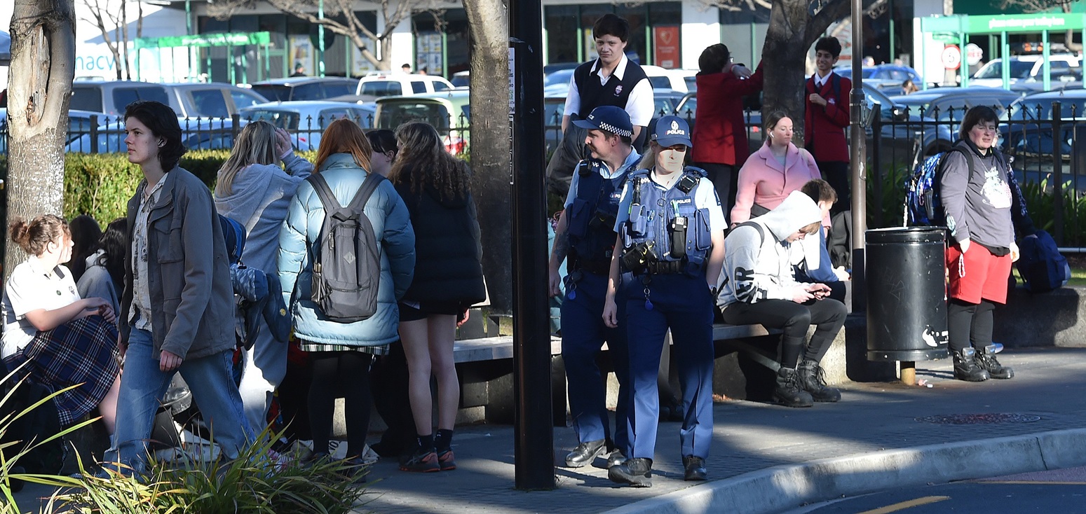 Police patrol through the bus hub in Great King St. Photo: Gregor Richardson