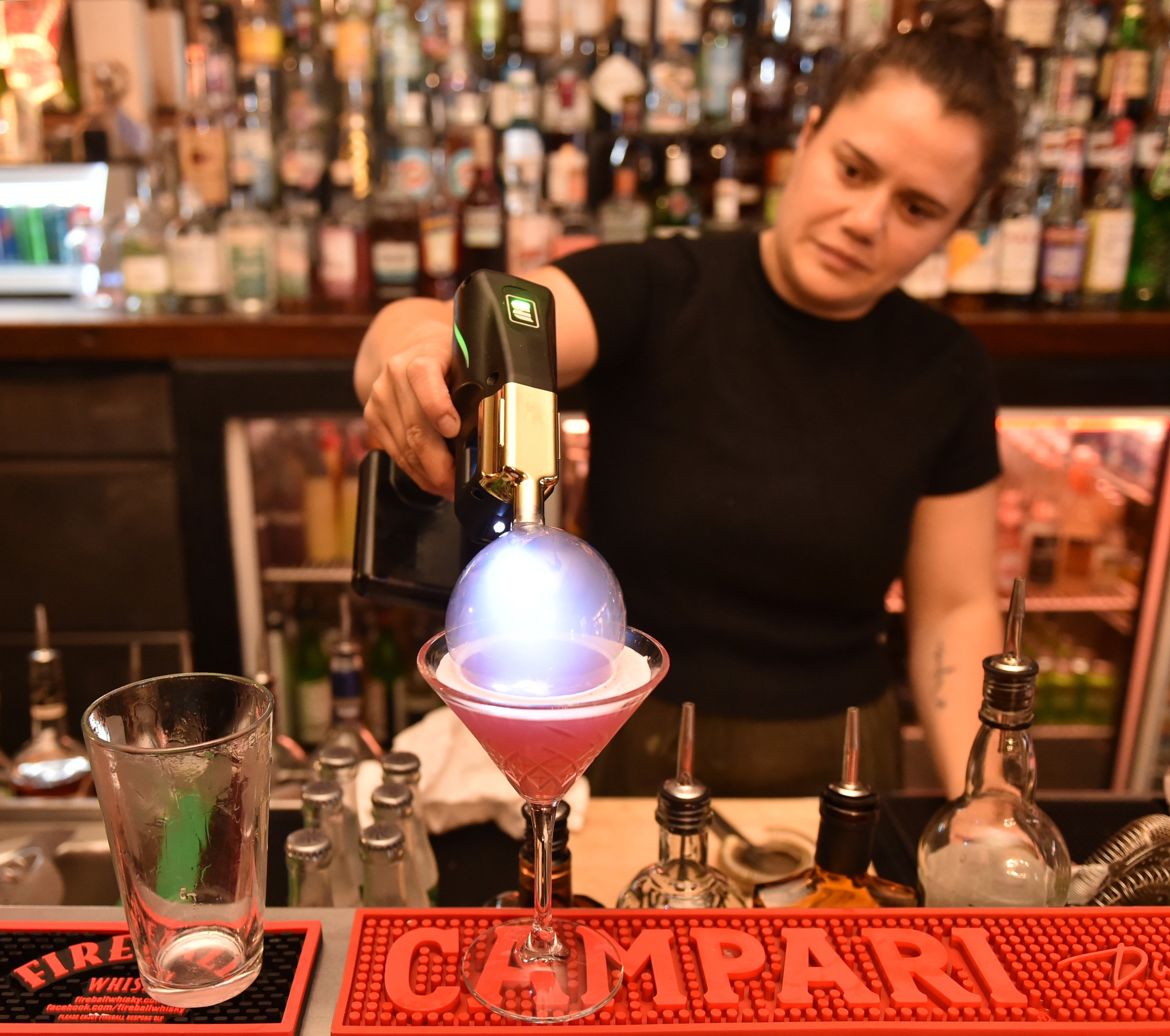 Jaz Stoddart shows how to make Pequeno’s smoke bubble peach cosmo. PHOTO: GREGOR RICHARDSON