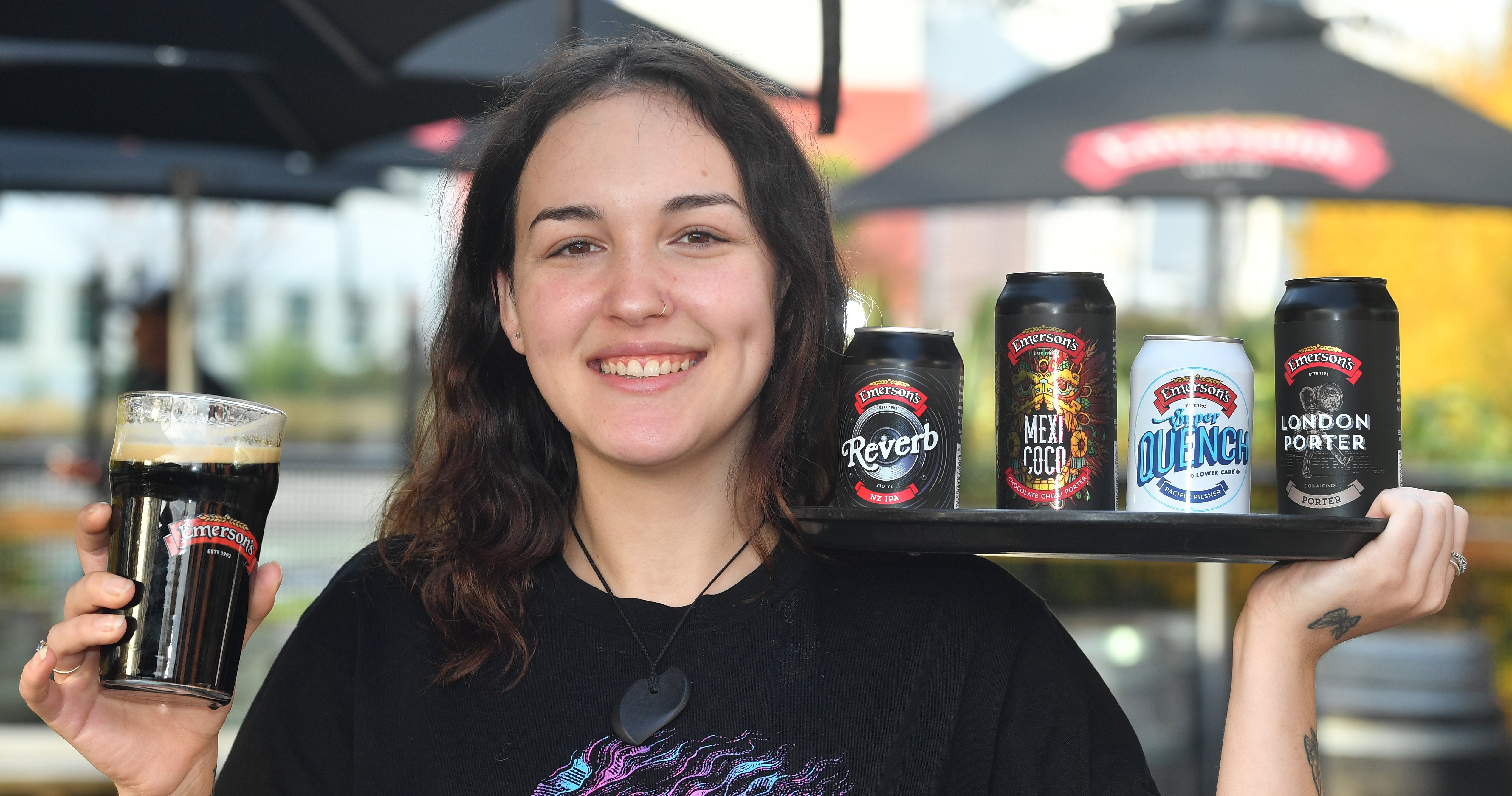 Emerson’s Brewery employee Myah Darning with the brewery’s four award-winning beers. PHOTO:...