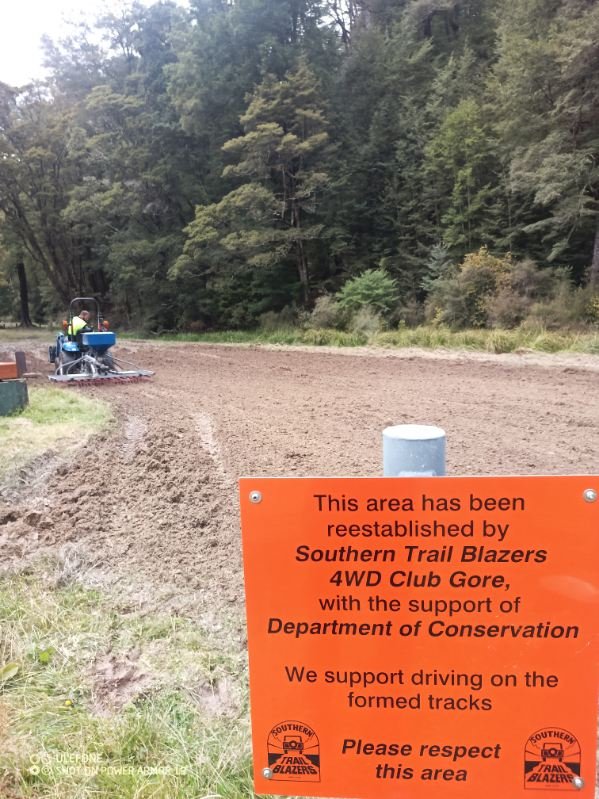 A member of the Southern Trail Blazers 4WD club sows grass at an area of Piano Flat earlier this...