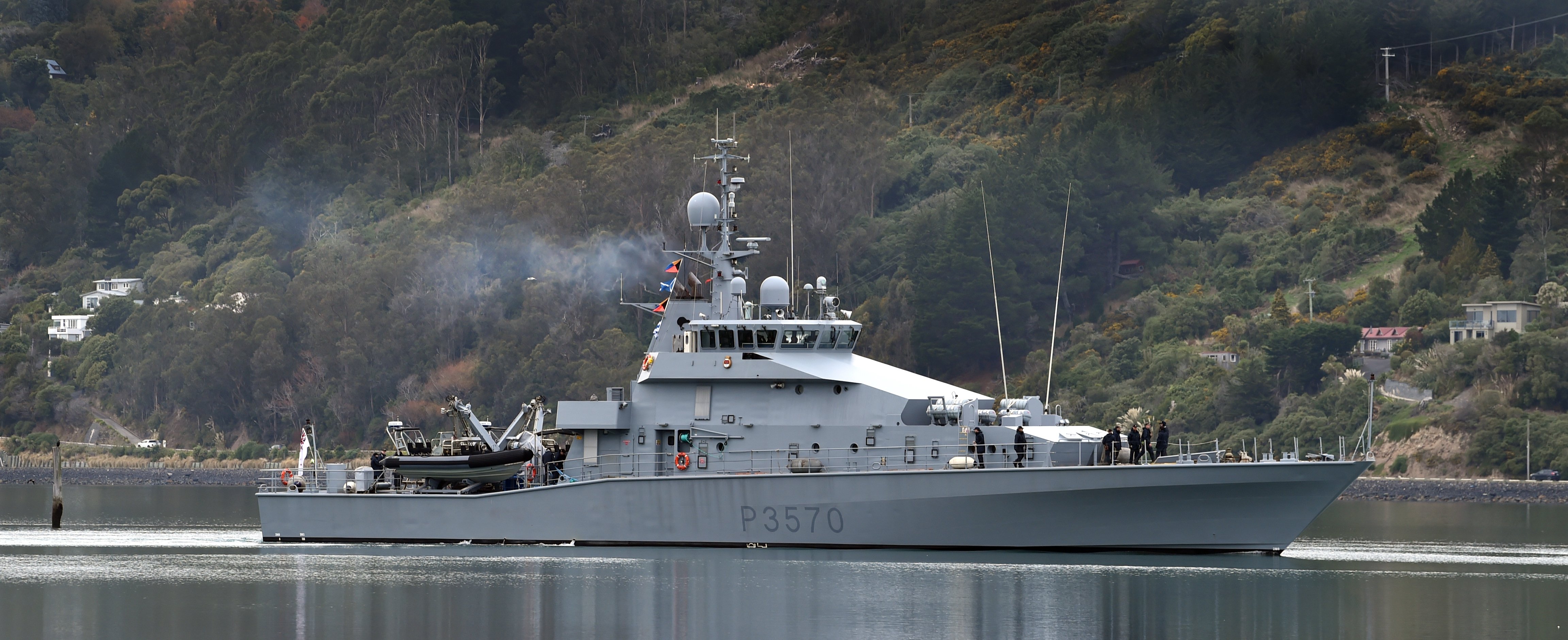 Inshore patrol vessel HMNZS Taupō enters the Otago Harbour Basin yesterday. On board are junior...