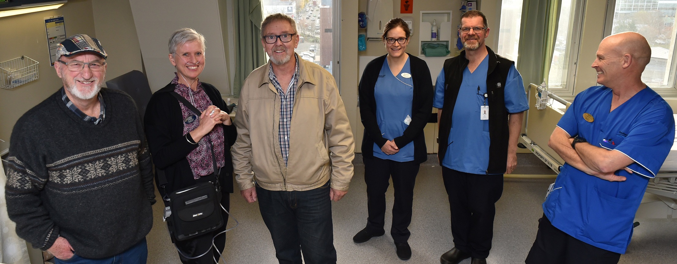 Otago Masonic Charitable Trust representatives Grant Watson (left) and Mel Darling flank...