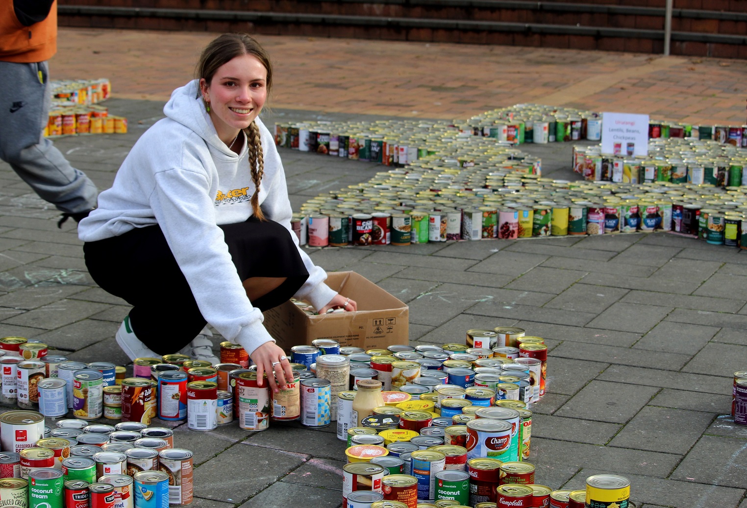 Presbyterian Support Otago volunteer Philippa Schaefer places cans during the 2023 Octacan...