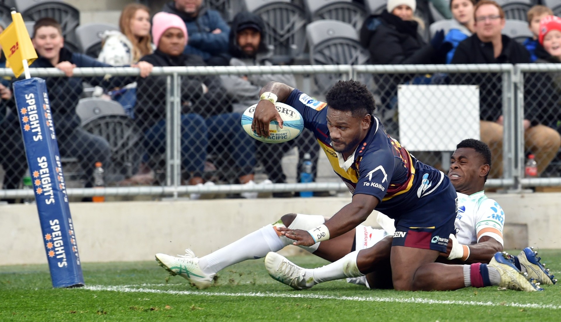 Drua player Taniela Rakuro can't stop Timoci Tavatavanawai from scoring a try for the Highlanders...