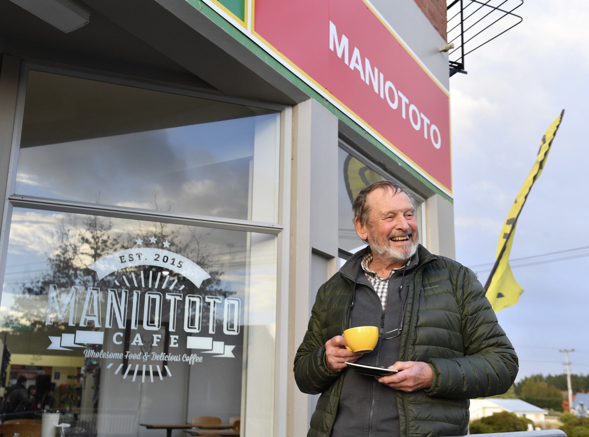 Richard Bowman, of Lake Hayes, enjoys a cuppa outside the Maniototo Cafe in Ranfurly. Photo:...