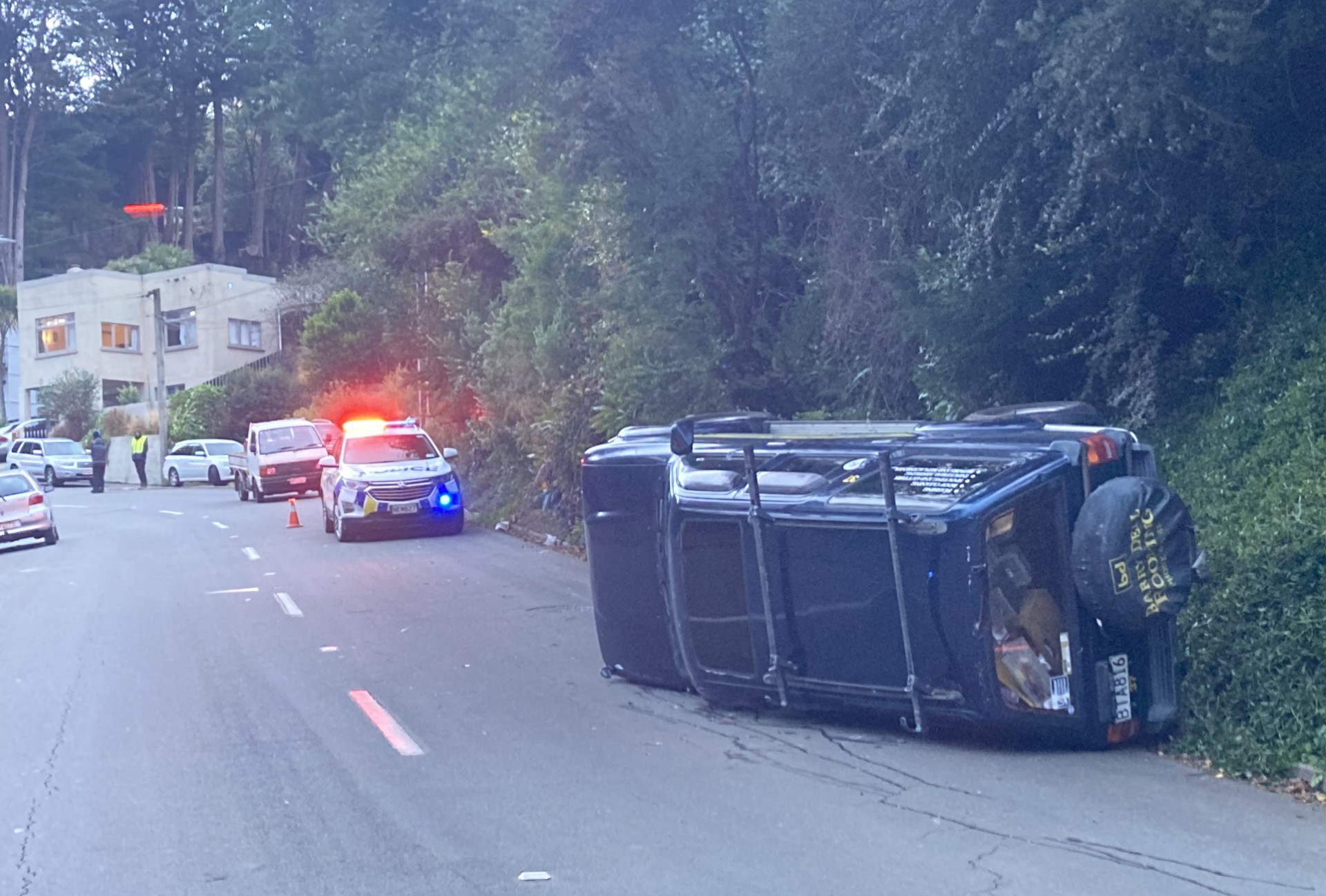 A runaway 4WD lies on its side after rolling over in North Rd at about 4pm on Saturday. Photo:...