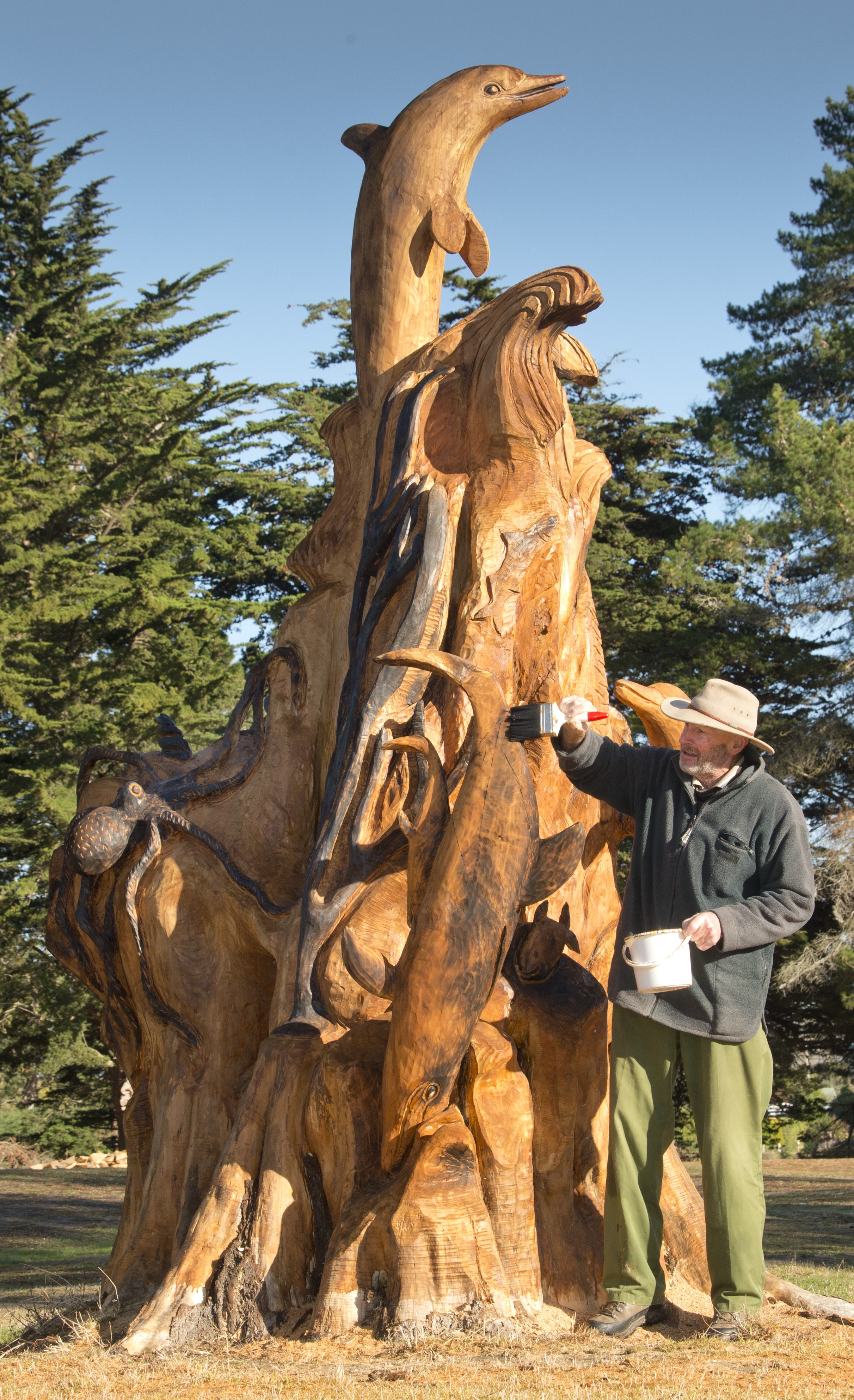 John Beattie applies sealer to a sculpture at the Waikouaiti Golf Club yesterday. PHOTOS: GERARD...