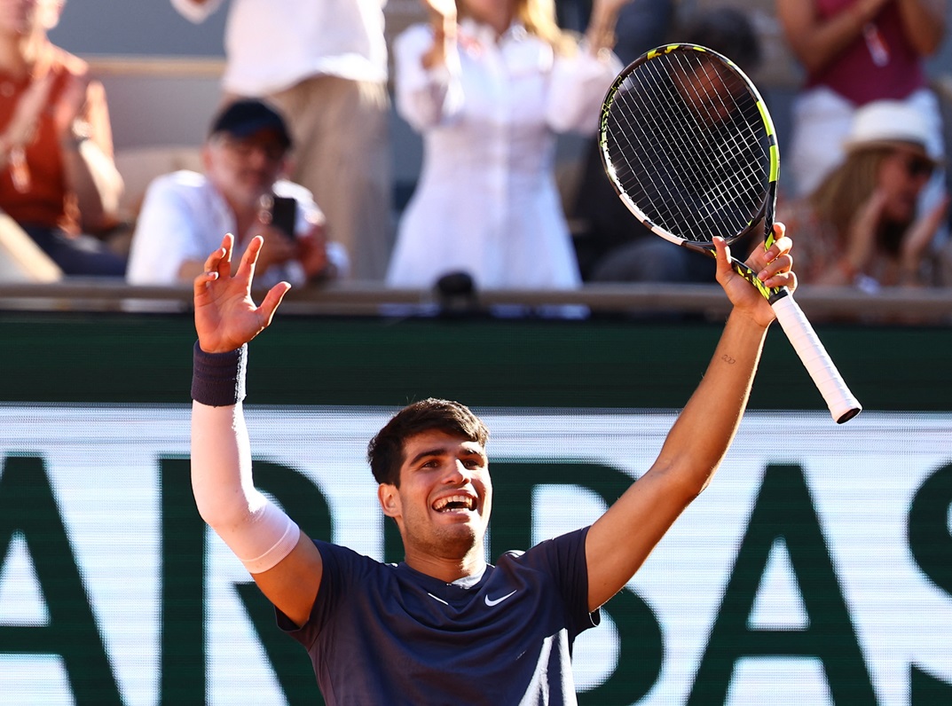 Spain's Carlos Alcaraz celebrates winning his French open semifinal match against Italy's Jannik...