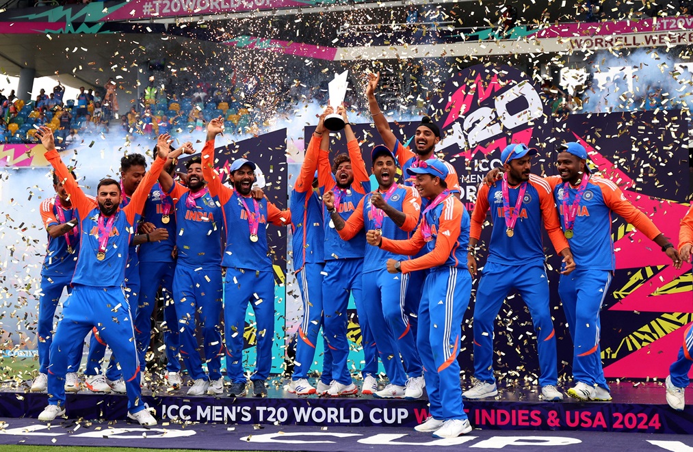 India's Kuldeep Yadav lifts the trophy as the team celebrate their victory. Photo: Reuters