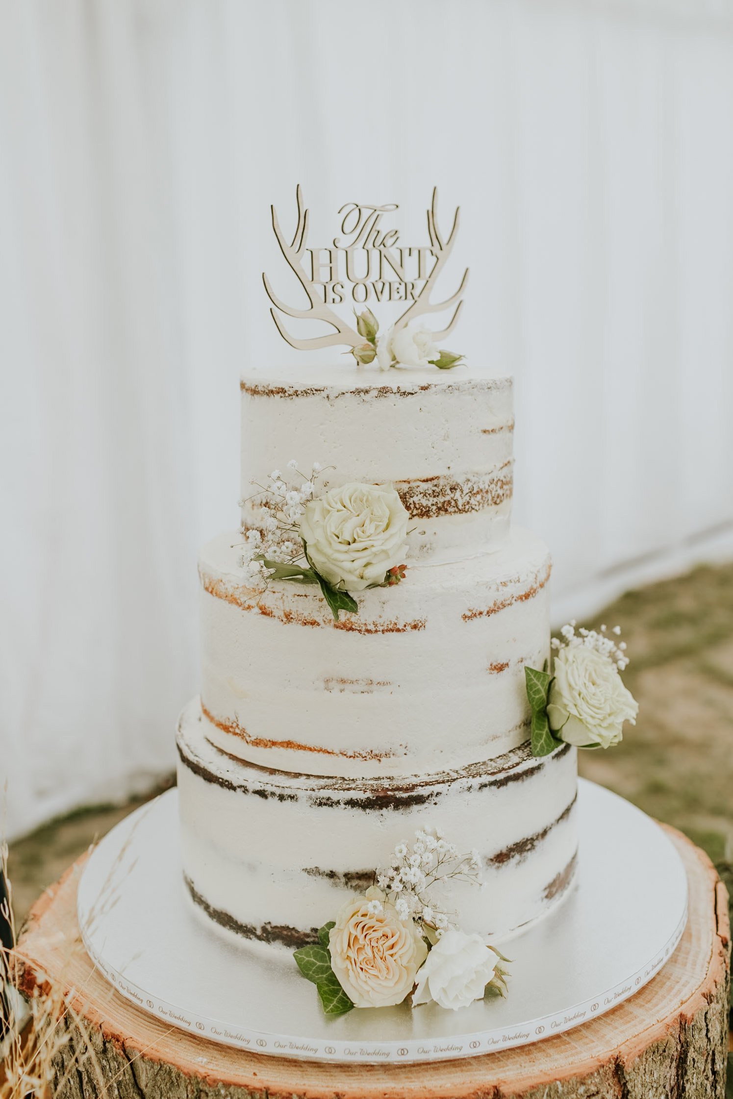 The three-tier wedding cake was made by the groom’s aunt, Bronwyn Frazer, and was flavoured...