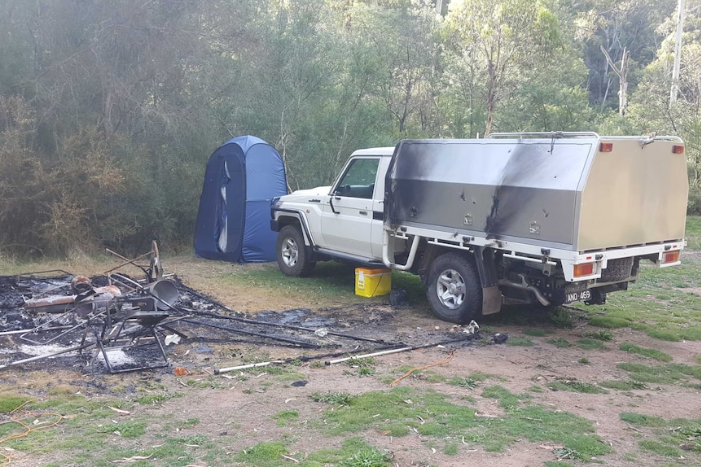 The pair's campsite was found burnt, but Mr Hill's car was still there. Photo: Supplied