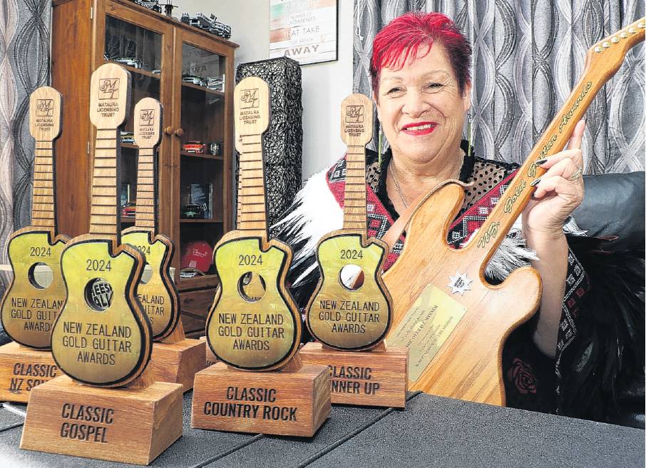 Sharon Russell with the awards she won at the New Zealand Gold Guitar Awards in Gore. PHOTO: JOHN...