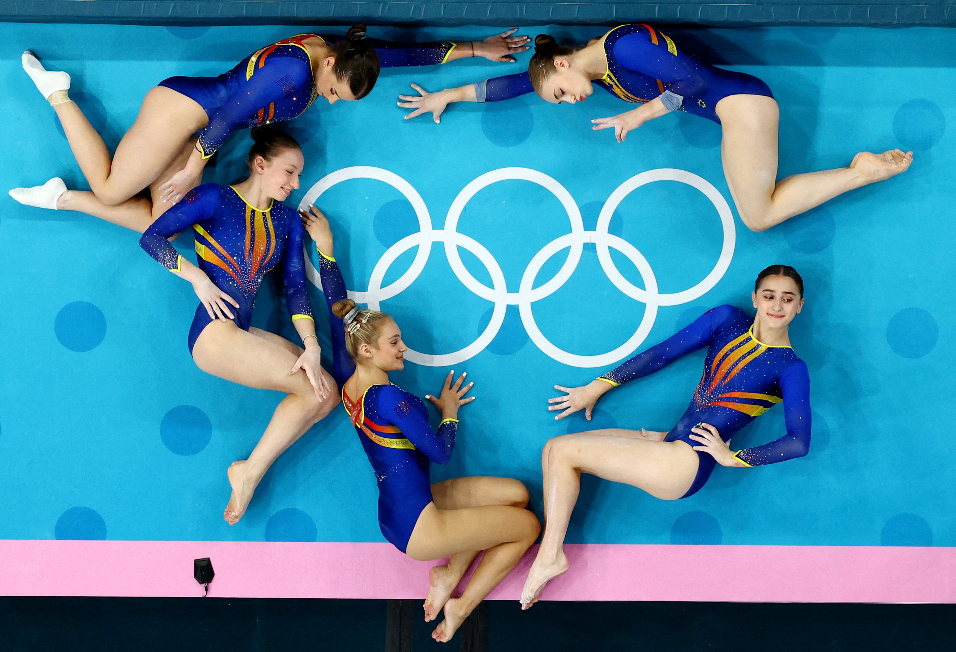 Romanian artistic gymnasts pose during a training session in Paris. PHOTO: REUTERS