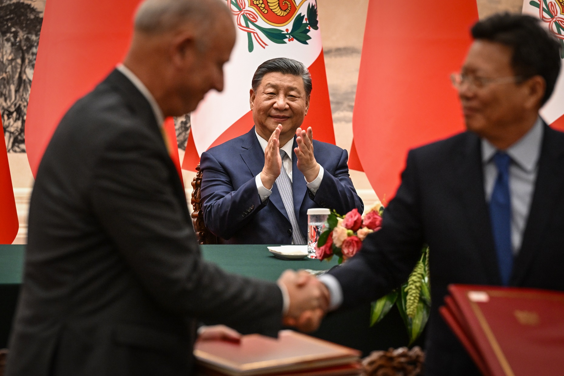 China’s President Xi Jinping applauds during a meeting between Chinese and Peruvian officials....