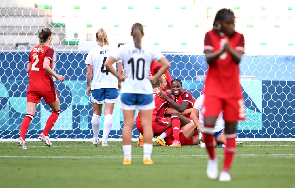 Canada's Cloe Lacasse celebrates scoring her team's first goal during the match against New...