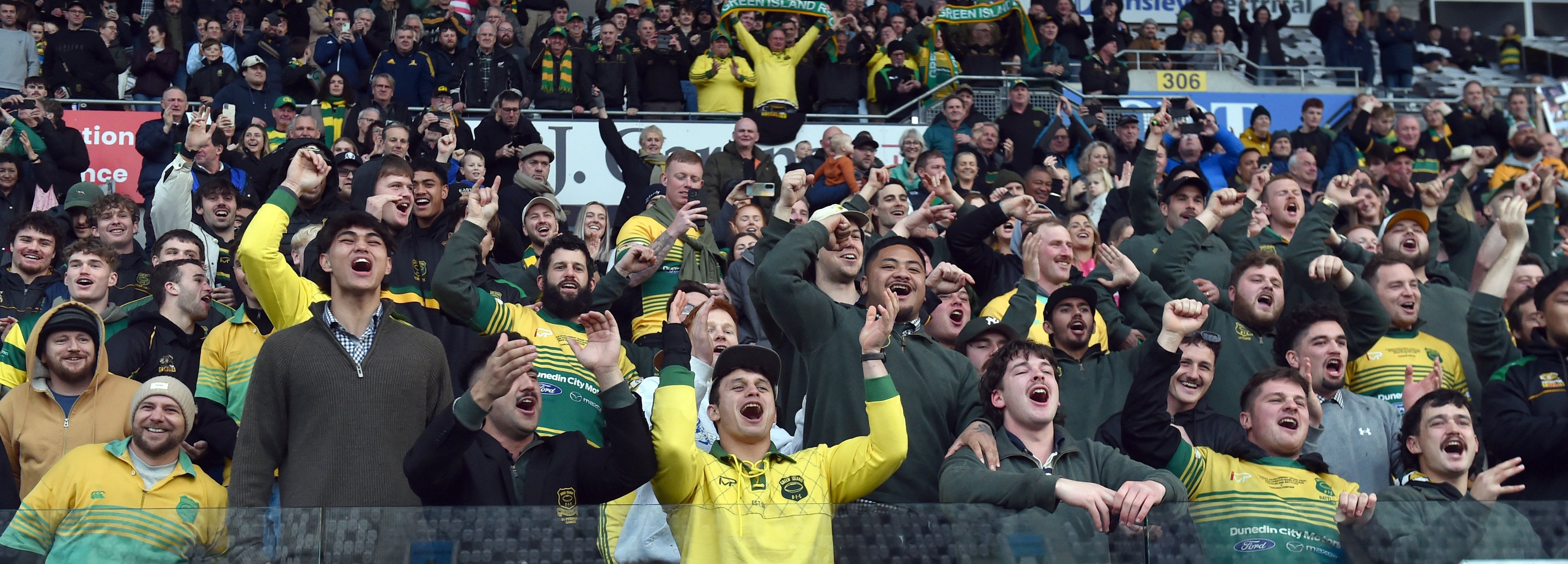 Green Island supporters show their delight at the Dunedin club final at Forsyth Barr Stadium on...