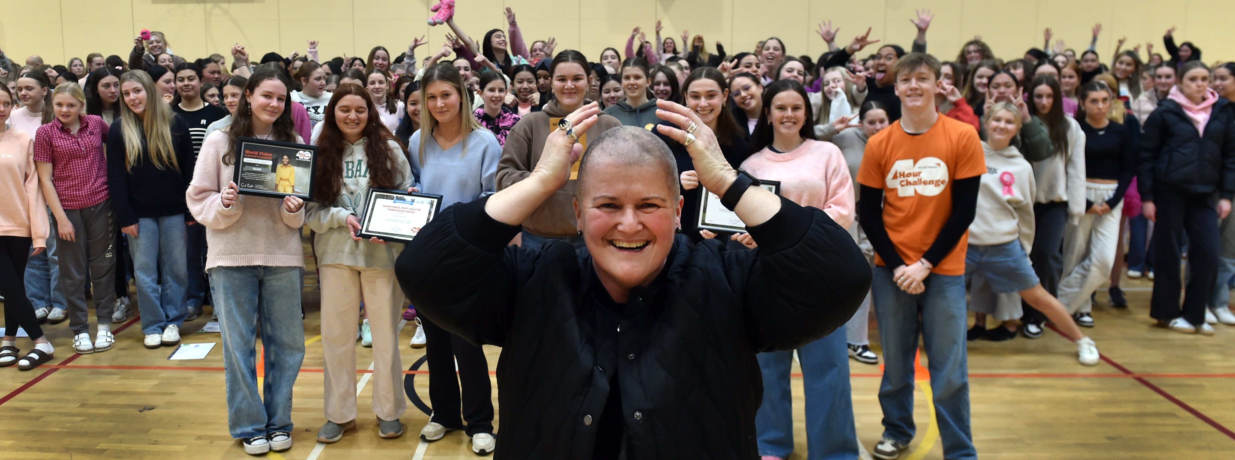 Queen’s High School deputy principal Stephanie Ashton after she received a hair cut at assembly...