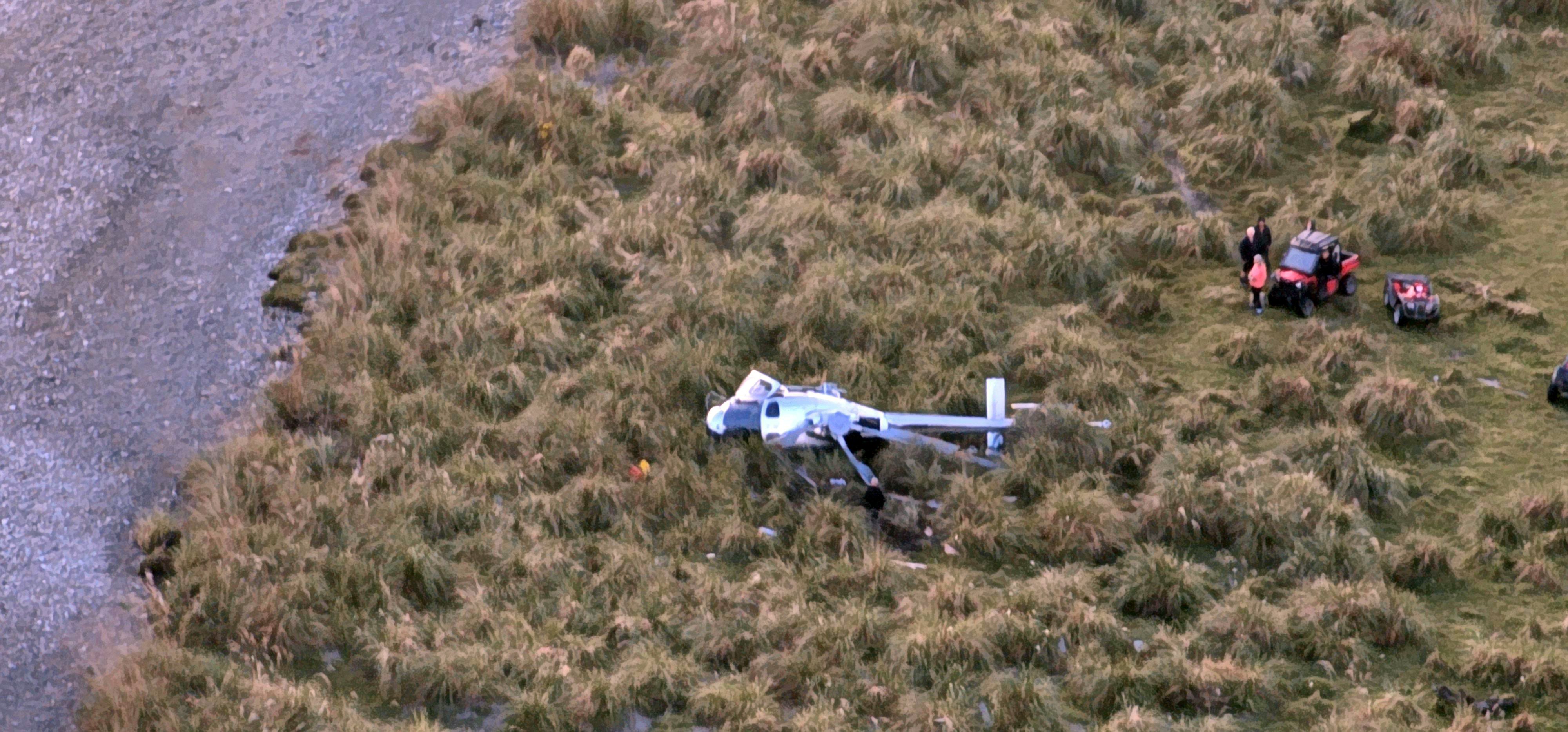 The crashed Squirrel helicopter at the mouth of the Paringa River on Saturday. PHOTO: SUPPLIED 