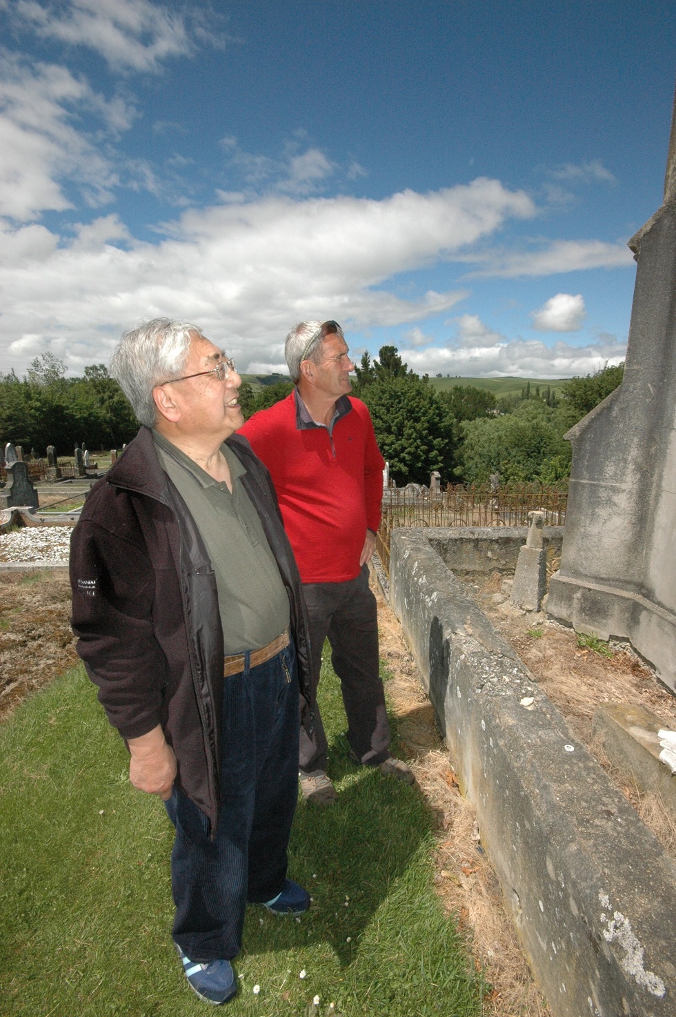 Dr James Ng and Ray Grubb examine the Mausoleum of Sam Chew Lian, in the Lawrence cemetery, in...