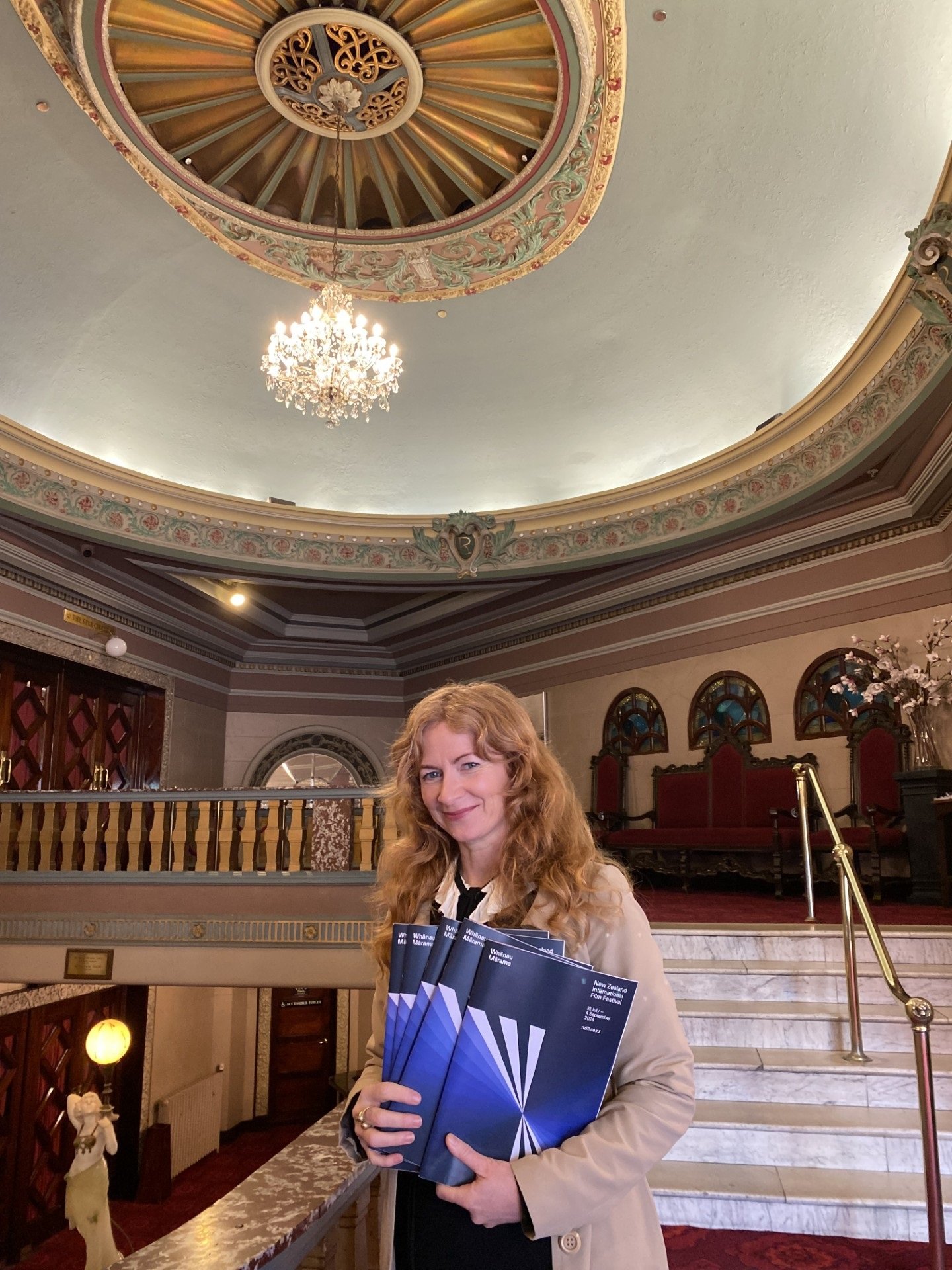 New Zealand International Film Festival Dunedin publicist Dallas Synnott holds some of the stacks...