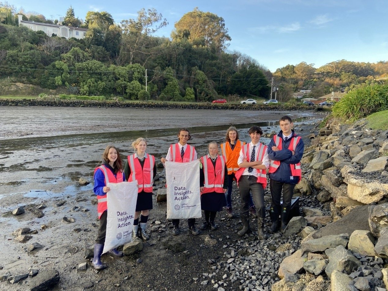 Bayfield High School students clean up the shoreline at Andersons Bay Inlet with support from...