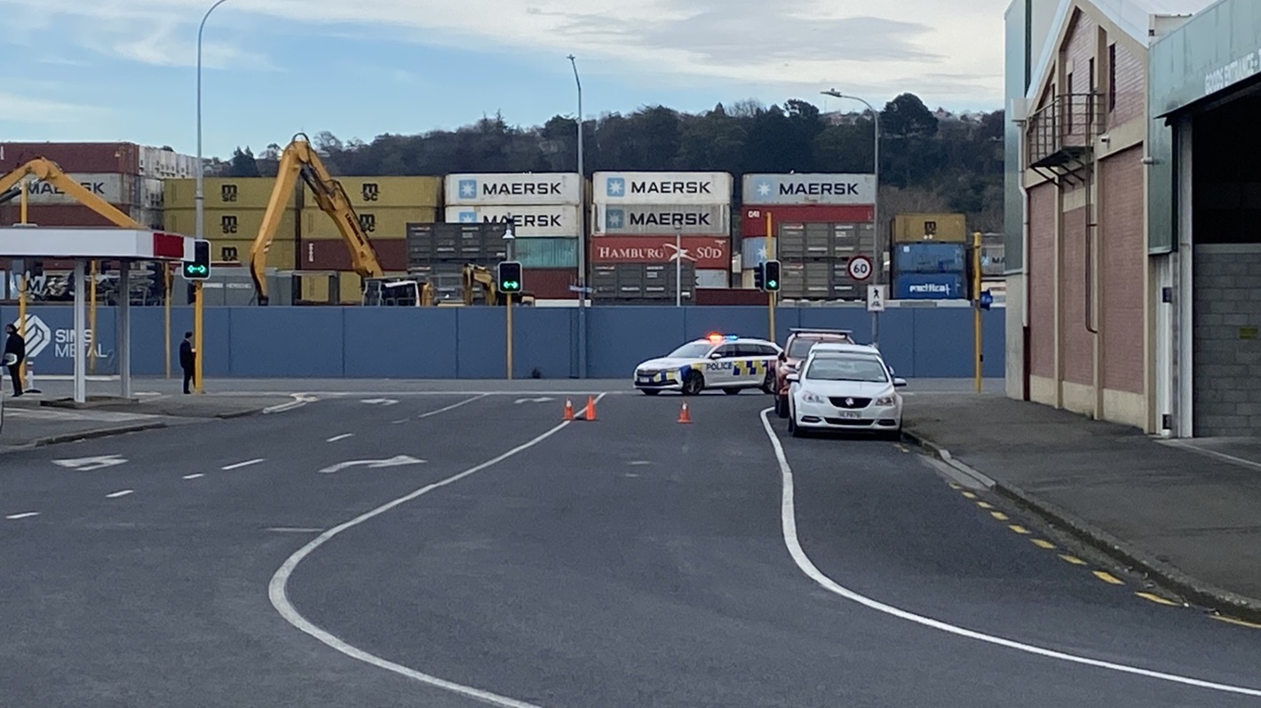 Police in Kitchener St amid a heavy presence in Dunedin's industrial area on Friday. Photo: Craig...