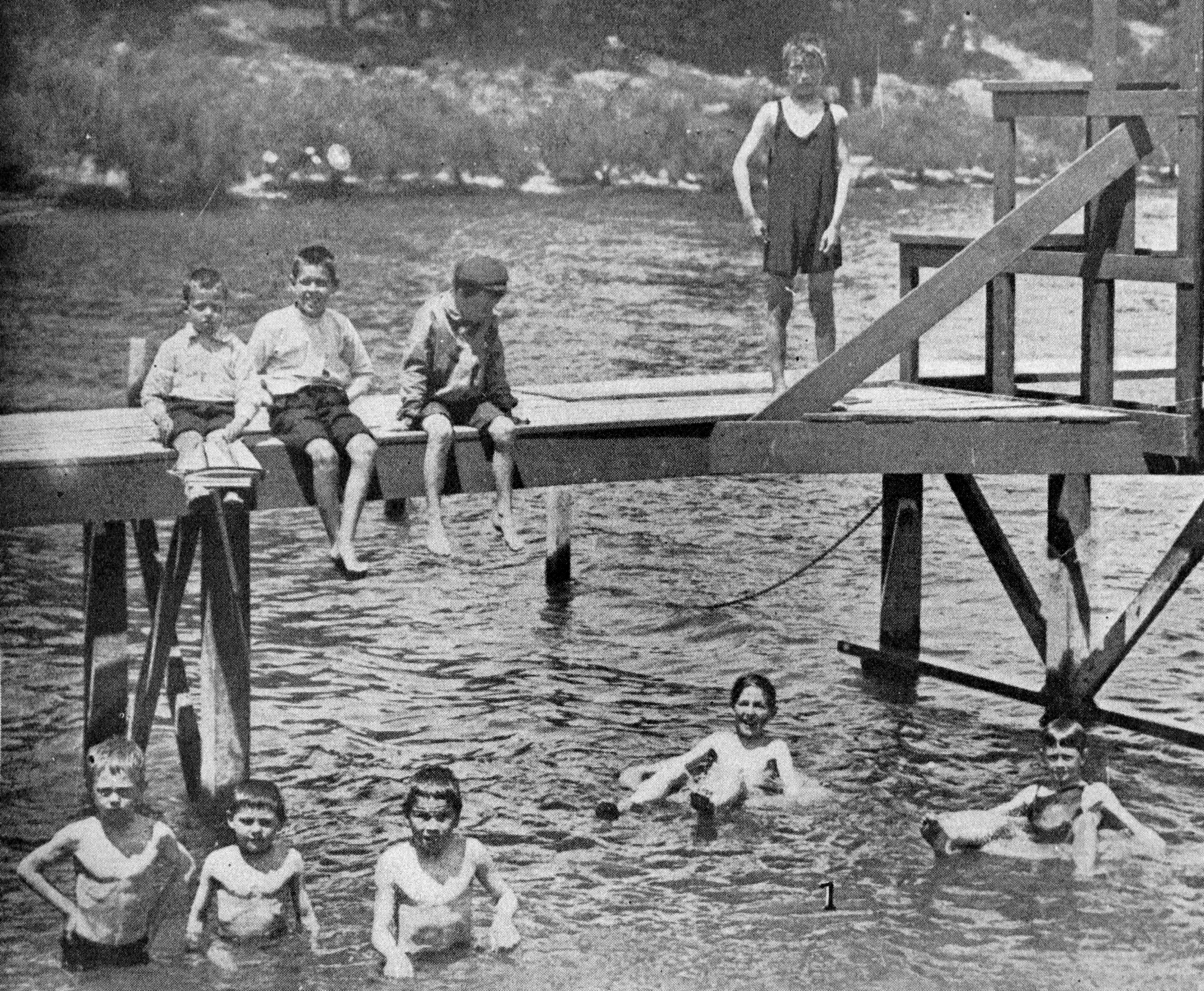 Children play in Lake Wakatipu, Queenstown, early in 1924. — Otago Witness, 25.3.1924