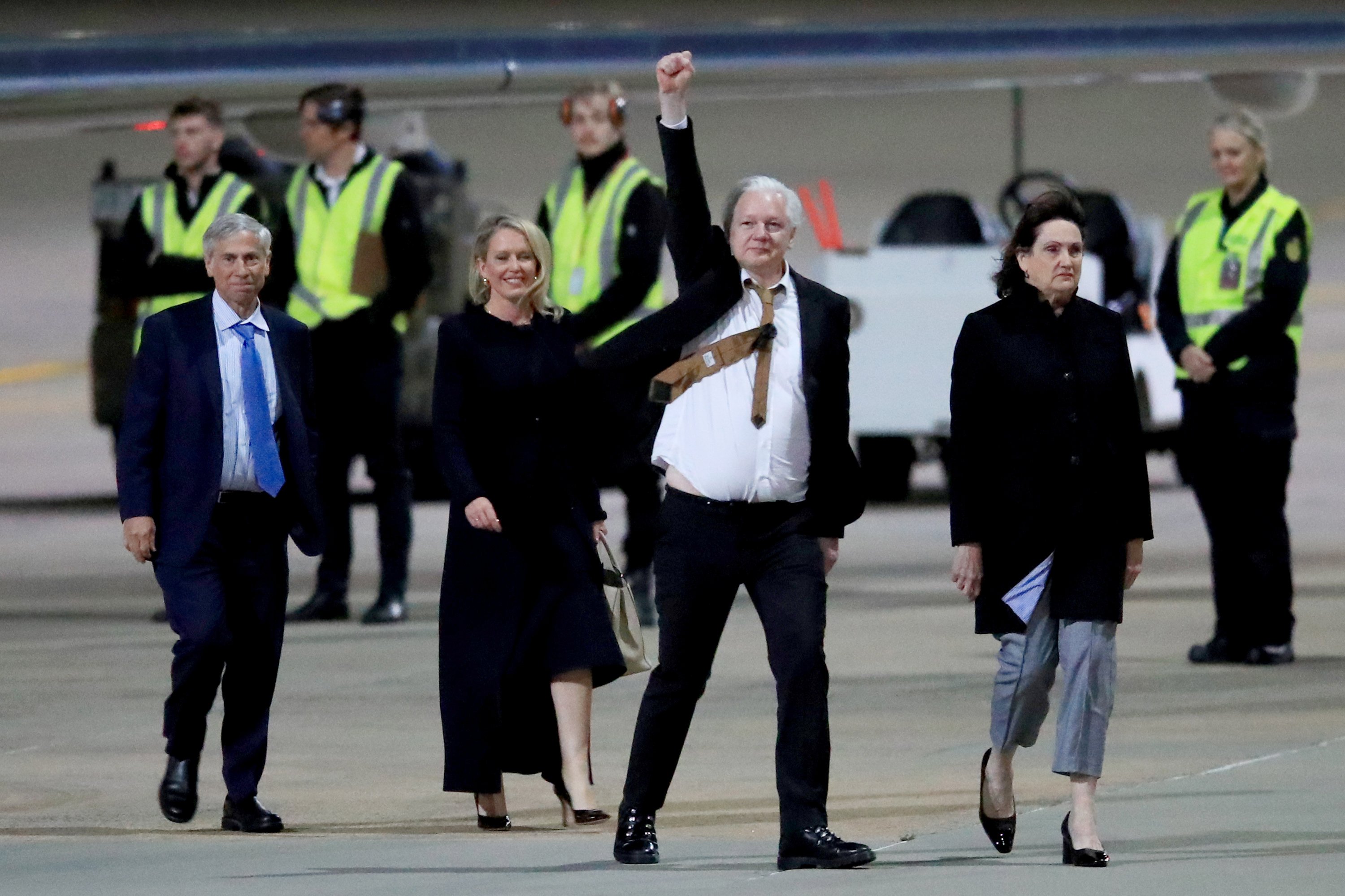 WikiLeaks founder Julian Assange gestures as he arrives at Canberra Airport. PHOTO: GETTY IMAGES