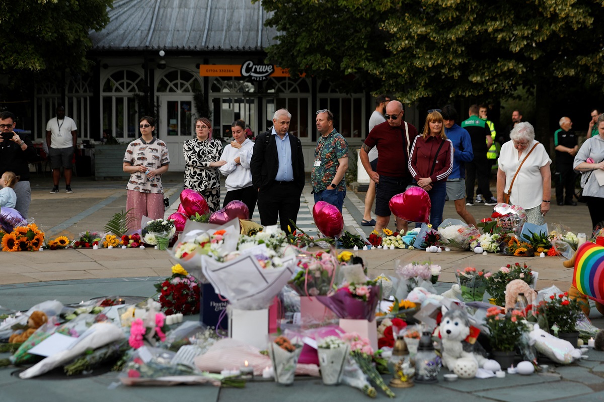 Floral tributes are laid in Southport following a vigil for the victims of the knife attack....