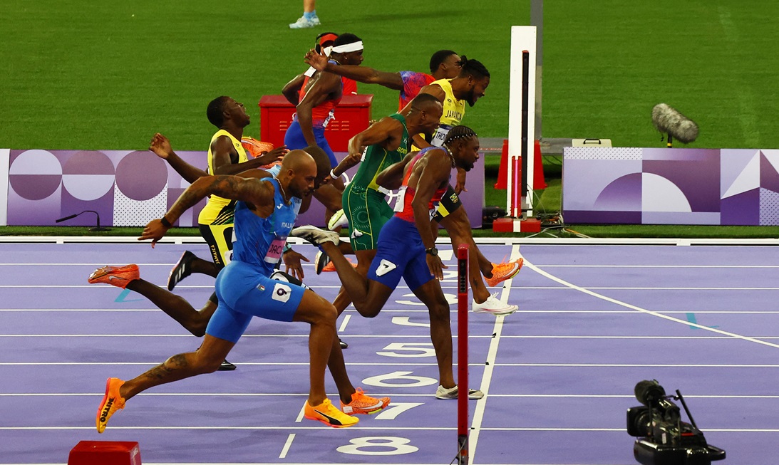 Noah Lyles crosses the line to win gold in the men's 100 metres. Photo: Reuters