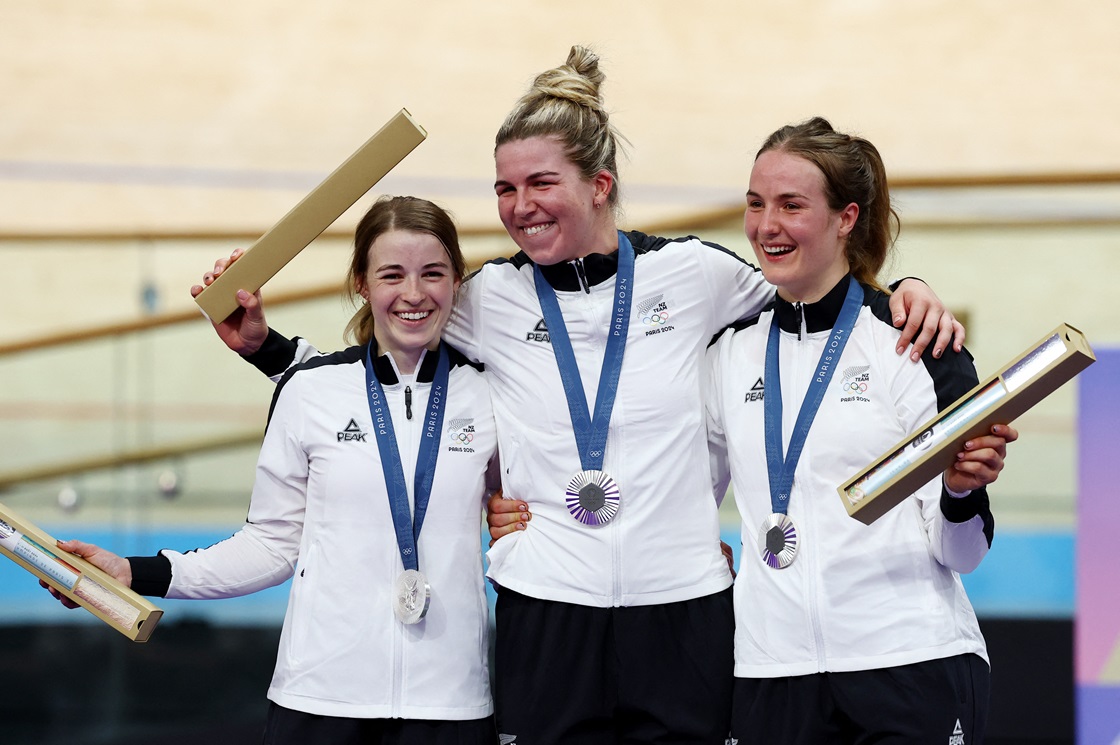 New Zealand track cyclists Rebecca Petch, Shaane Fulton and Ellesse Andrews celebrate on the...